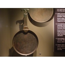 Bronze mirror, solar symbol with an animal on the handle